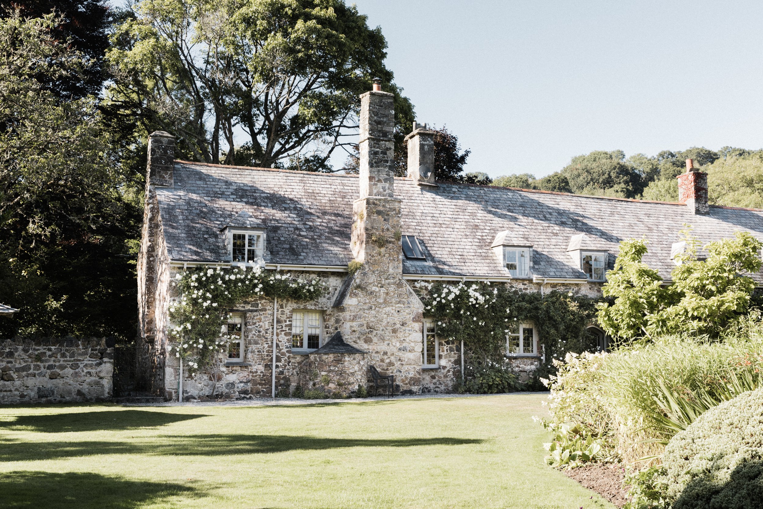 The exterior of accommodation at The Great Barn Devon, a 15th century barn wedding venue | Luxury wedding venue England Devon Wedding Venue |
