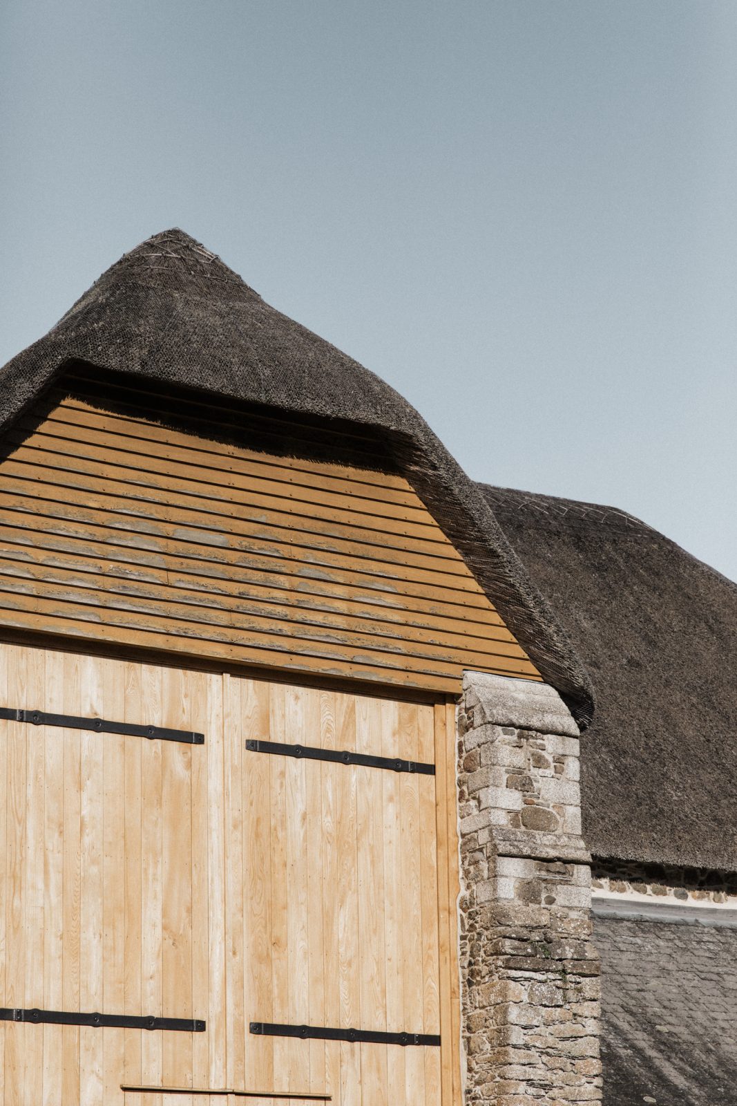 the great barn devon exclusive use wedding venue exterior thatched roof shot