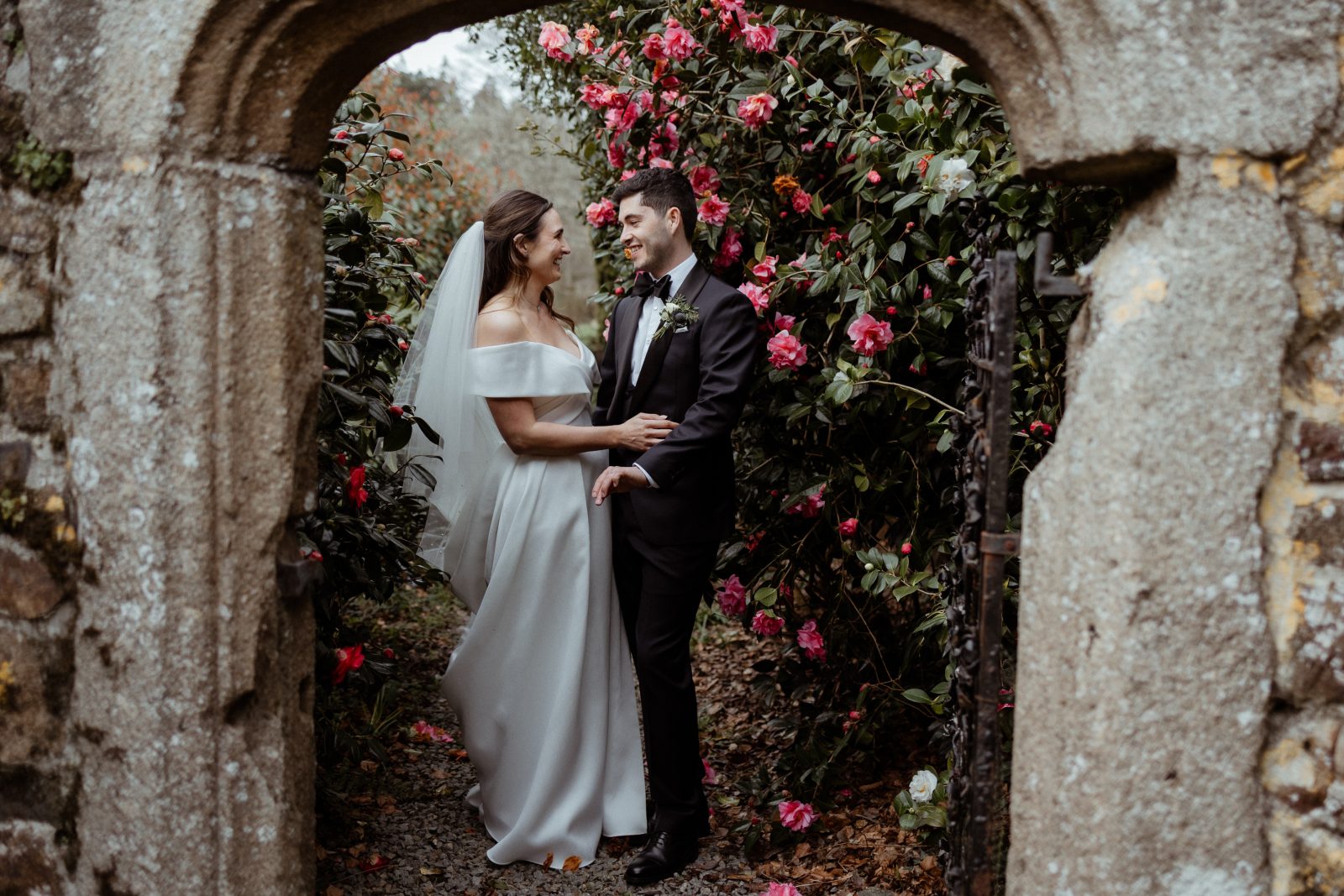 Alice & Ryan's Real Wedding at The Great Barn Devon | Couple Portrait in the Walled Rose Garden | Luxury Barn Wedding Venue