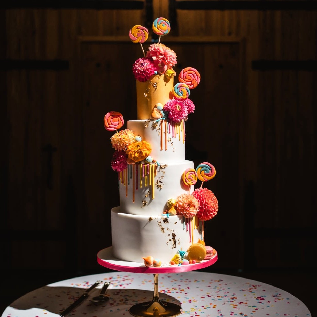 Wedding cake table on display inside The Great Barn Devon, luxury 15th century wedding venue in the countryside near Exeter Devon UK