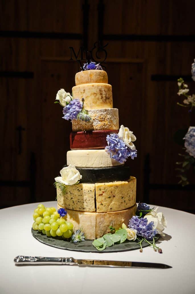 Wedding cheese cake on display during reception at The Great Barn Devon Luxury wedding venue England Devon Wedding Venue |