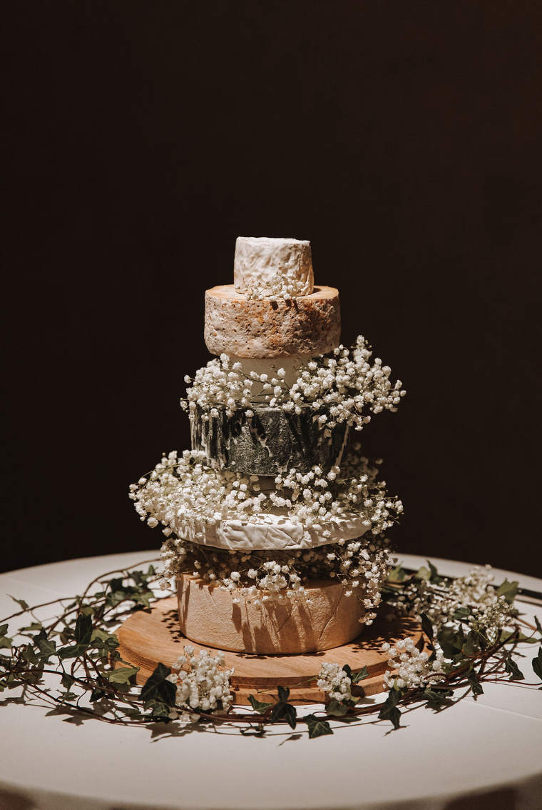 Wedding cheese cake on display during reception at The Great Barn Devon Luxury wedding venue England Devon Wedding Venue |