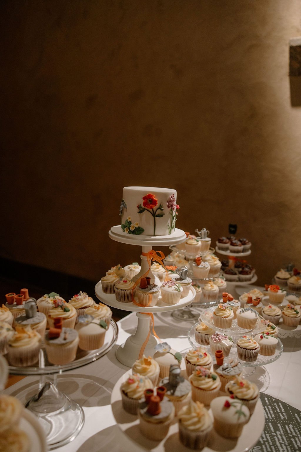 Wedding cake on display during reception at The Great Barn Devon Luxury wedding venue England Devon Wedding Venue |
