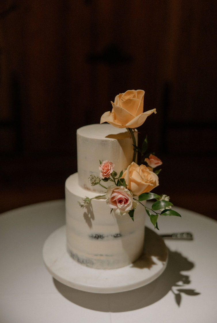 Wedding cake on display during reception at The Great Barn Devon Luxury wedding venue England Devon Wedding Venue |