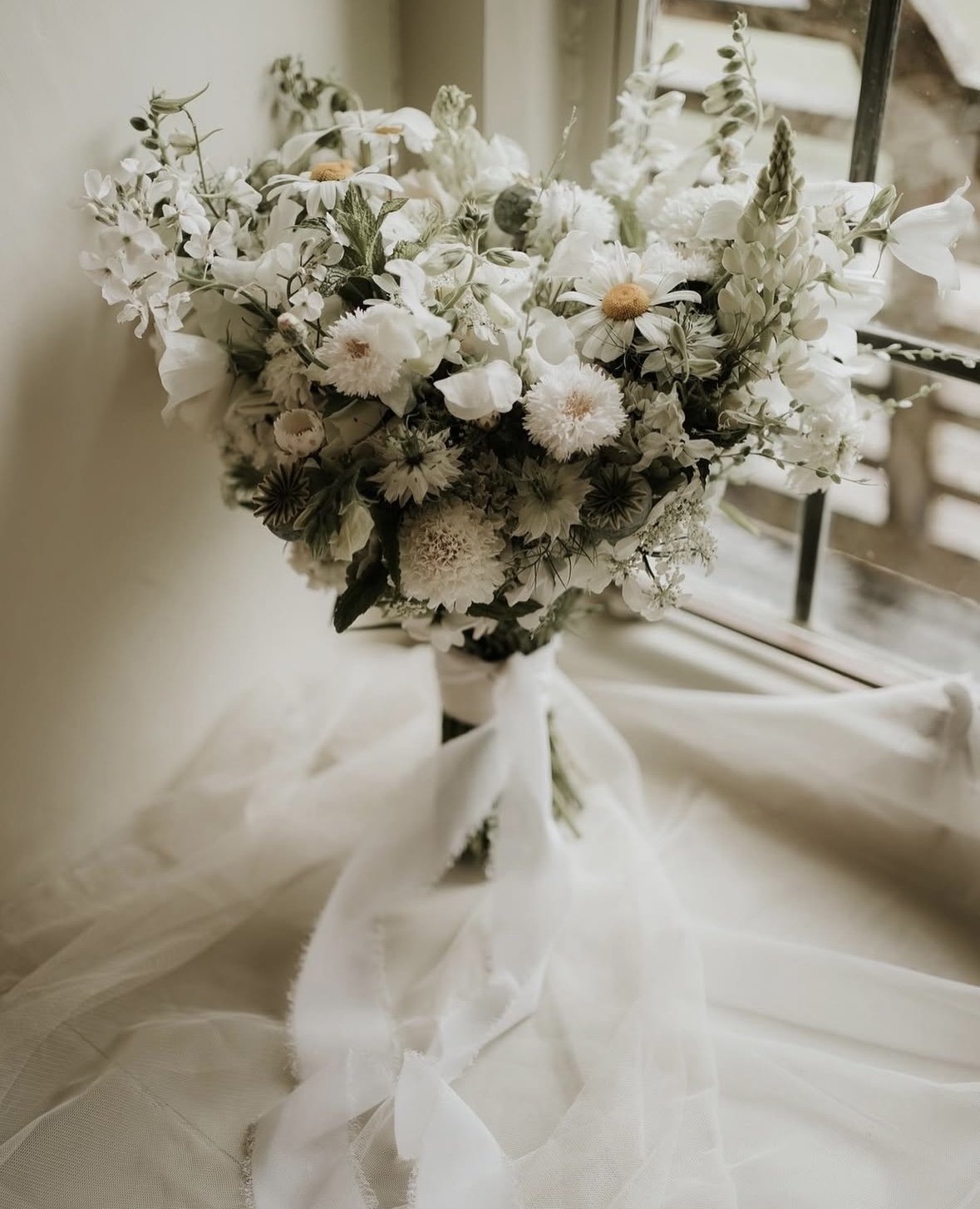 wedding flowers by Emma Hewlett Floral design, at a wedding venue | The Great Barn Devon supplier spotlight