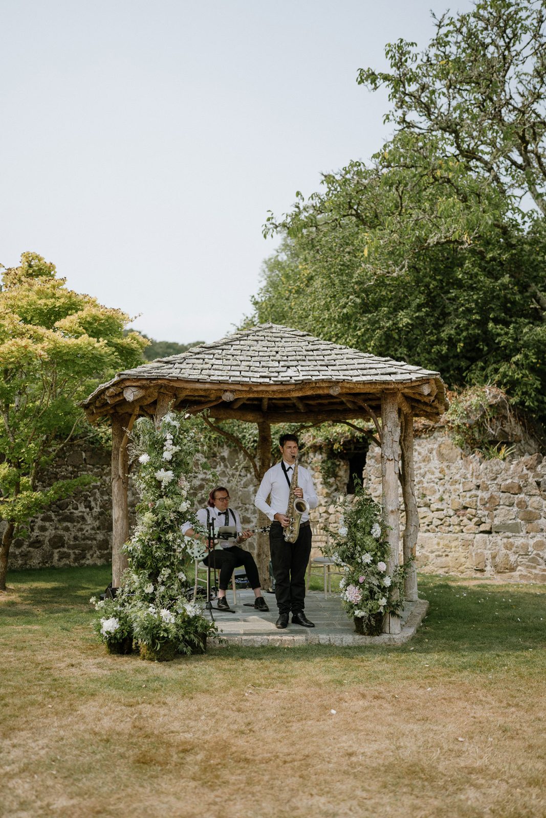 Hannah and Oli celebrating their wedding at The Great Barn Devon, featured in Wed Magazine