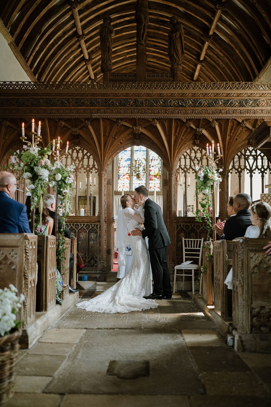 Hannah and Oli celebrating their wedding at The Great Barn Devon, featured in Wed Magazine