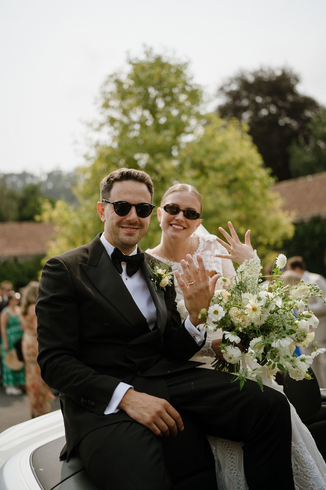 Hannah and Oli celebrating their wedding at The Great Barn Devon, featured in Wed Magazine