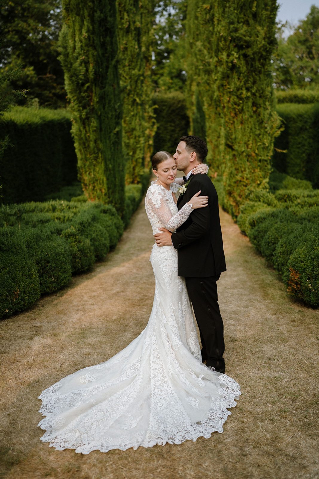 Hannah and Oli celebrating their wedding at The Great Barn Devon, featured in Wed Magazine