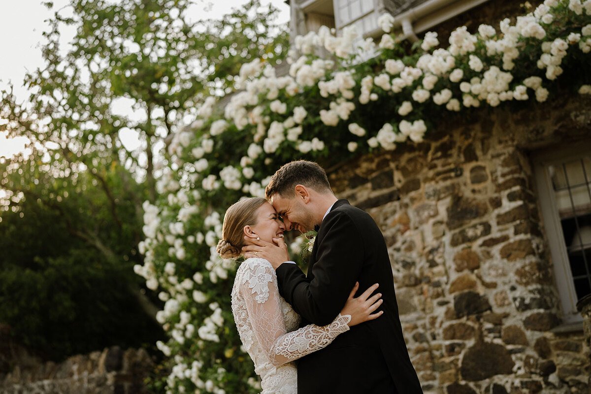 Hannah and Oli celebrating their wedding at The Great Barn Devon, featured in Wed Magazine
