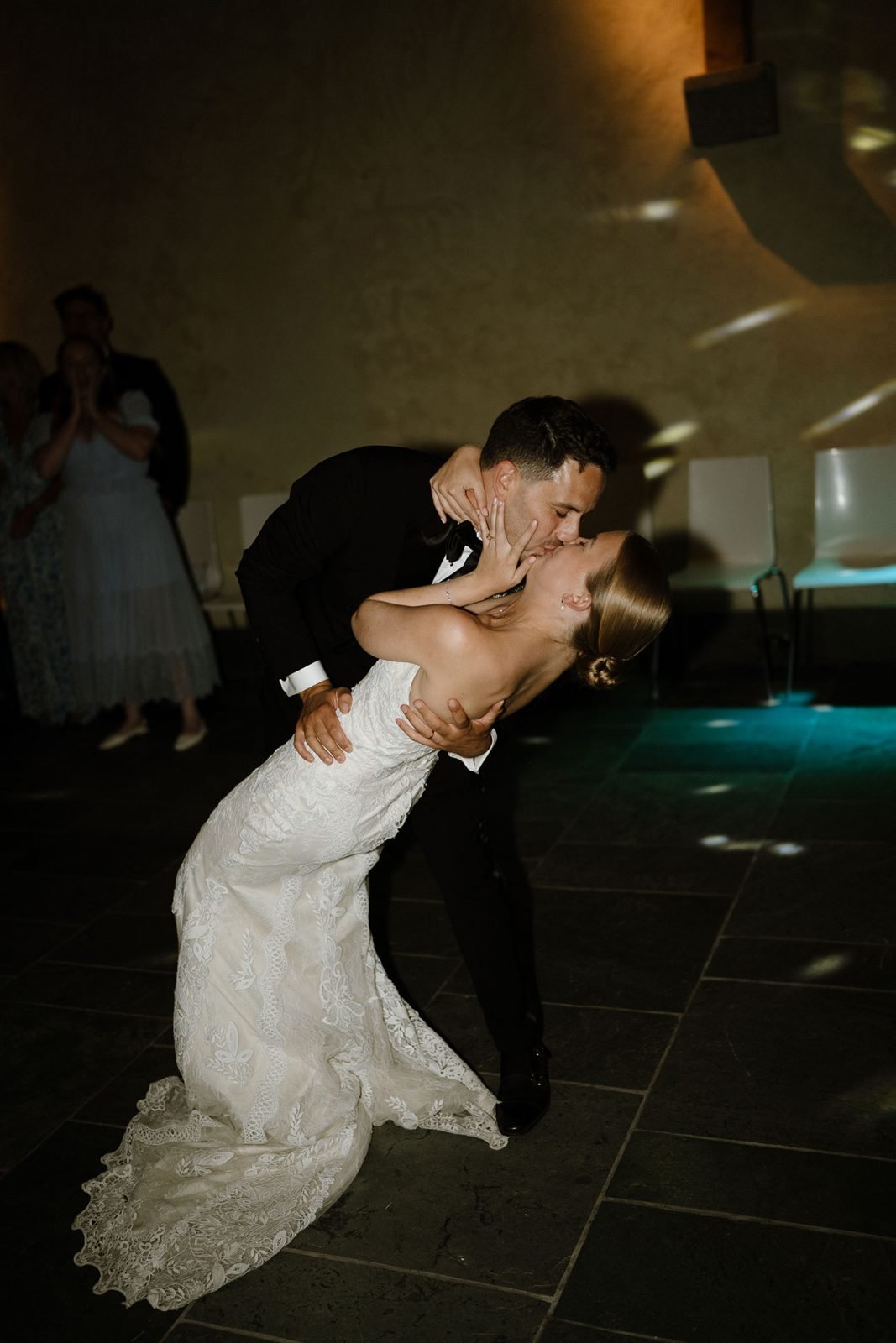 Hannah and Oli celebrating their wedding at The Great Barn Devon, featured in Wed Magazine