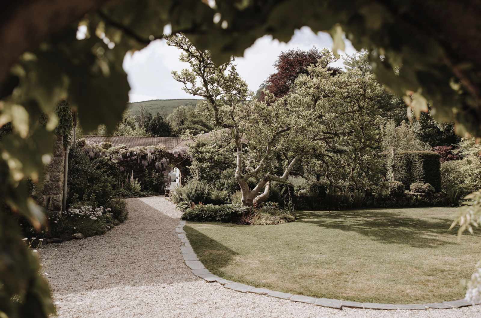 Screenshot 2026-03-11 at 11.15.34 exterior garden shot of the great barn devon wedding venue