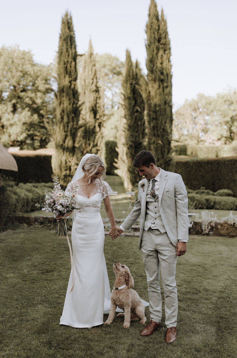 bride groom and dog at the great barn devon wedding